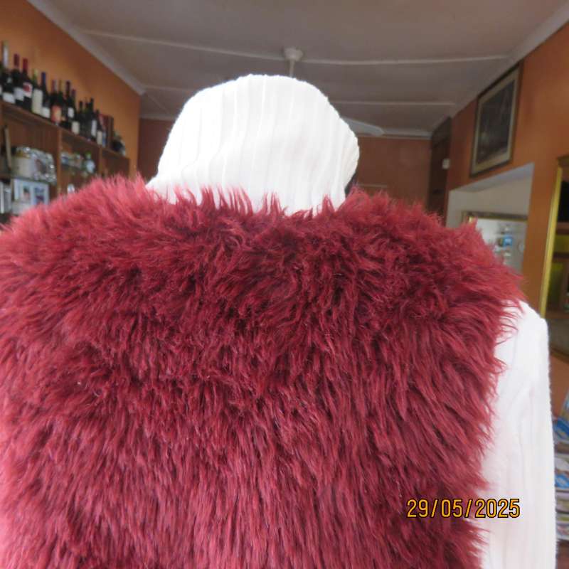 Burgundy faux fur polyester waistcoat with lining. Size 30 to 32. As new
