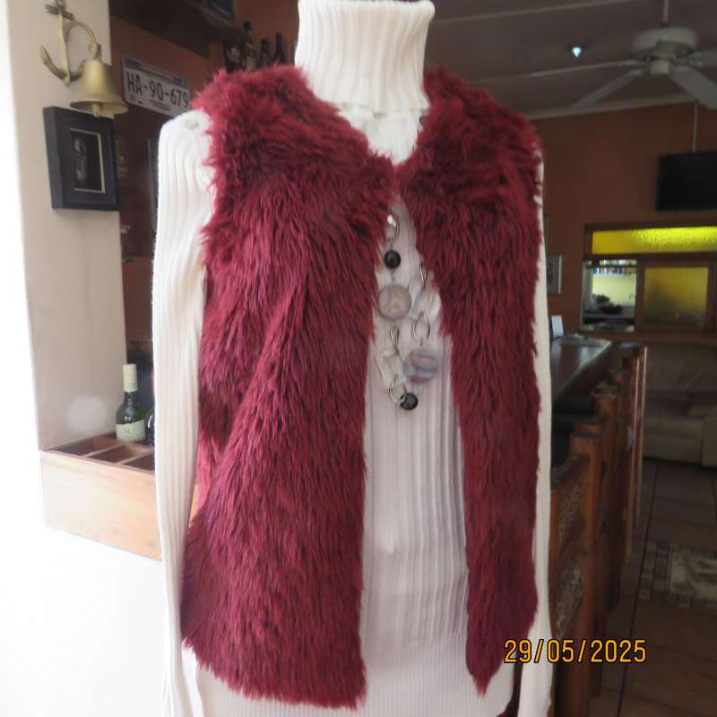 Burgundy faux fur polyester waistcoat with lining. Size 30 to 32. As new