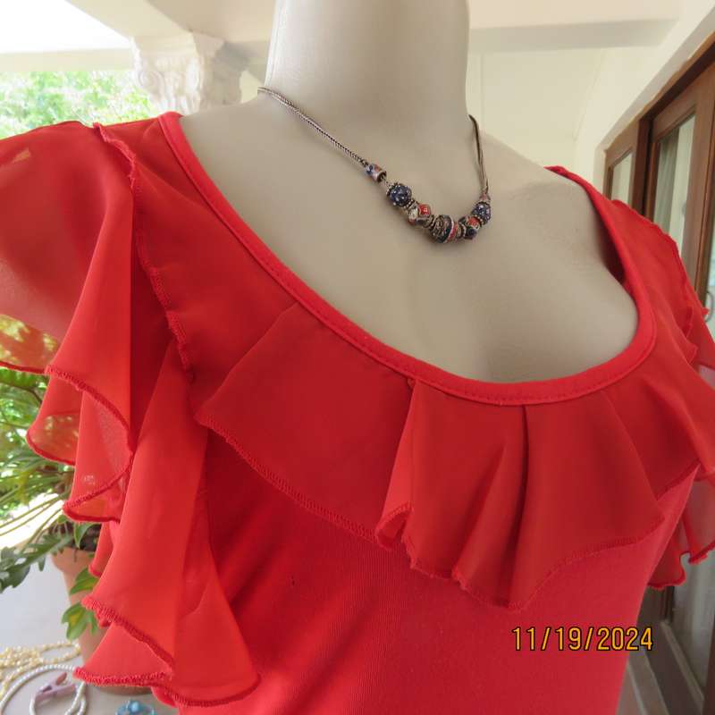 Pretty red slip over poly-rayon stretch top. Scooped frilled neckline and armholes.Size 32. Good con