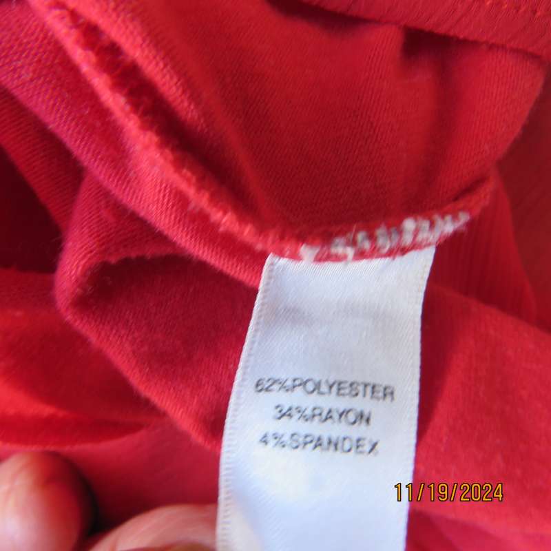 Pretty red slip over poly-rayon stretch top. Scooped frilled neckline and armholes.Size 32. Good con