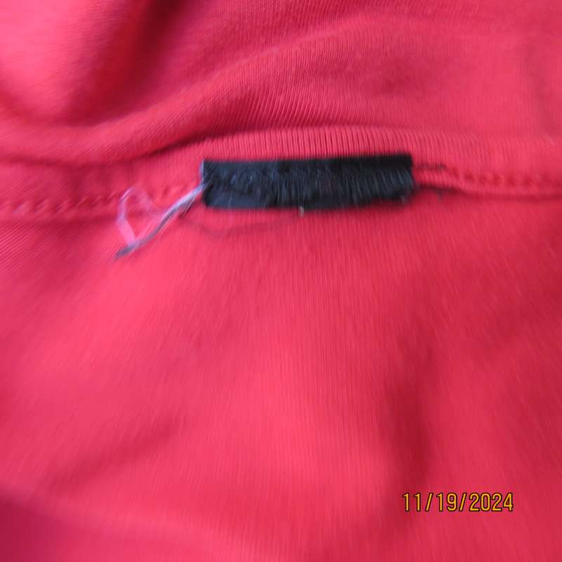 Pretty red slip over poly-rayon stretch top. Scooped frilled neckline and armholes.Size 32. Good con