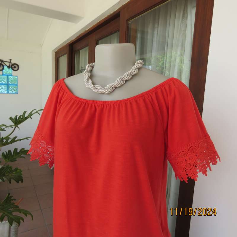Eye catching bright red slip over polyester top. Short sleeves. Wide elasticated neckline.Size 36.