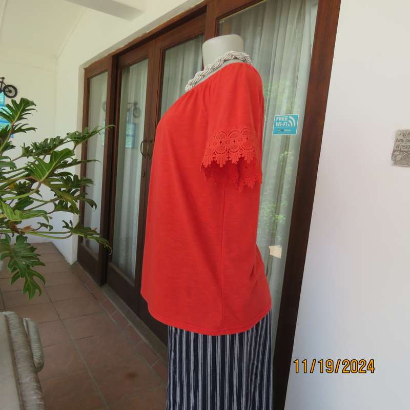 Eye catching bright red slip over polyester top. Short sleeves. Wide elasticated neckline.Size 36.