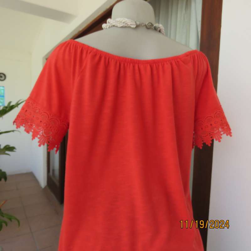 Eye catching bright red slip over polyester top. Short sleeves. Wide elasticated neckline.Size 36.