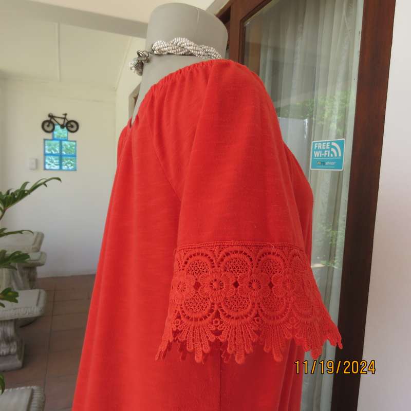 Eye catching bright red slip over polyester top. Short sleeves. Wide elasticated neckline.Size 36.