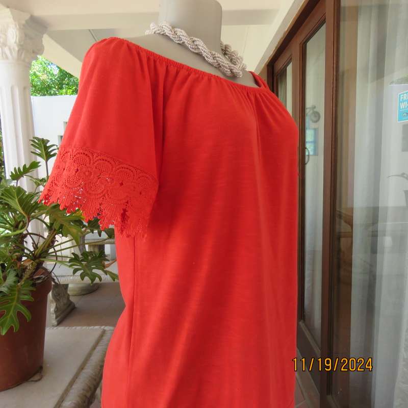 Eye catching bright red slip over polyester top. Short sleeves. Wide elasticated neckline.Size 36.