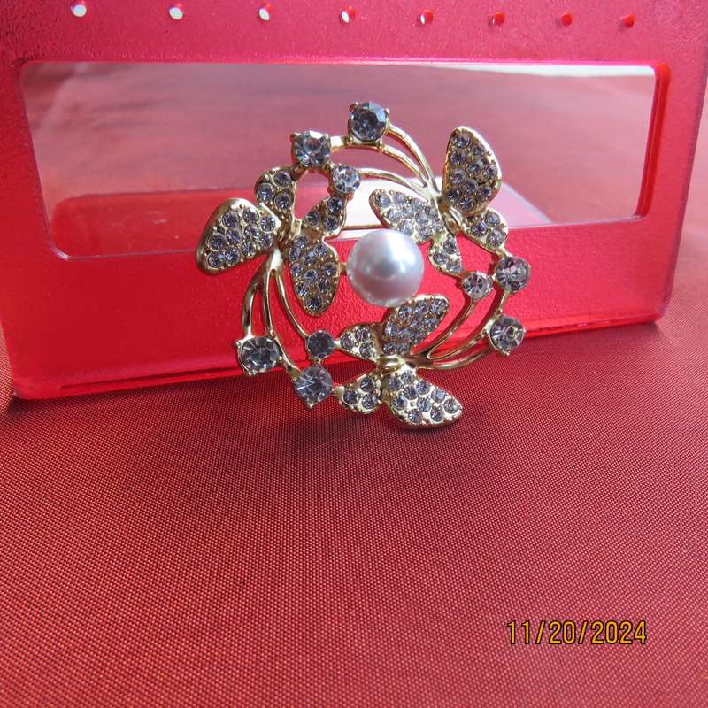 Stunning butterfly brooch 4cm diam. in gold with lots of simulated diamonds. New item.
