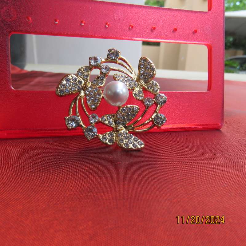 Stunning butterfly brooch 4cm diam. in gold with lots of simulated diamonds. New item.