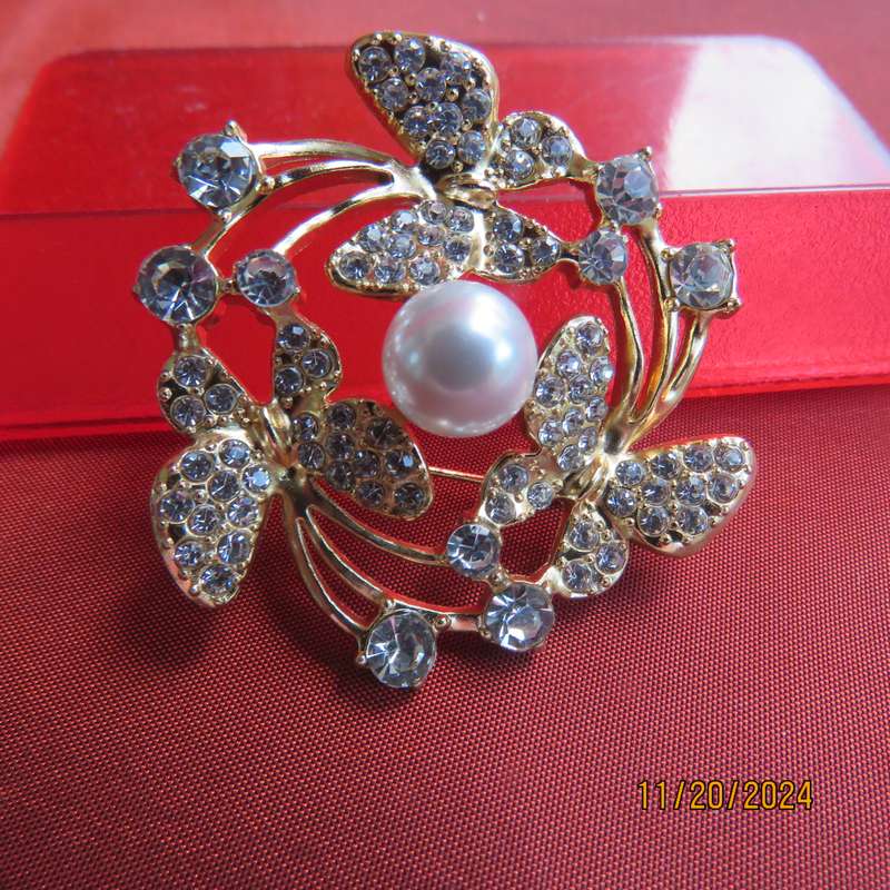 Stunning butterfly brooch 4cm diam. in gold with lots of simulated diamonds. New item.