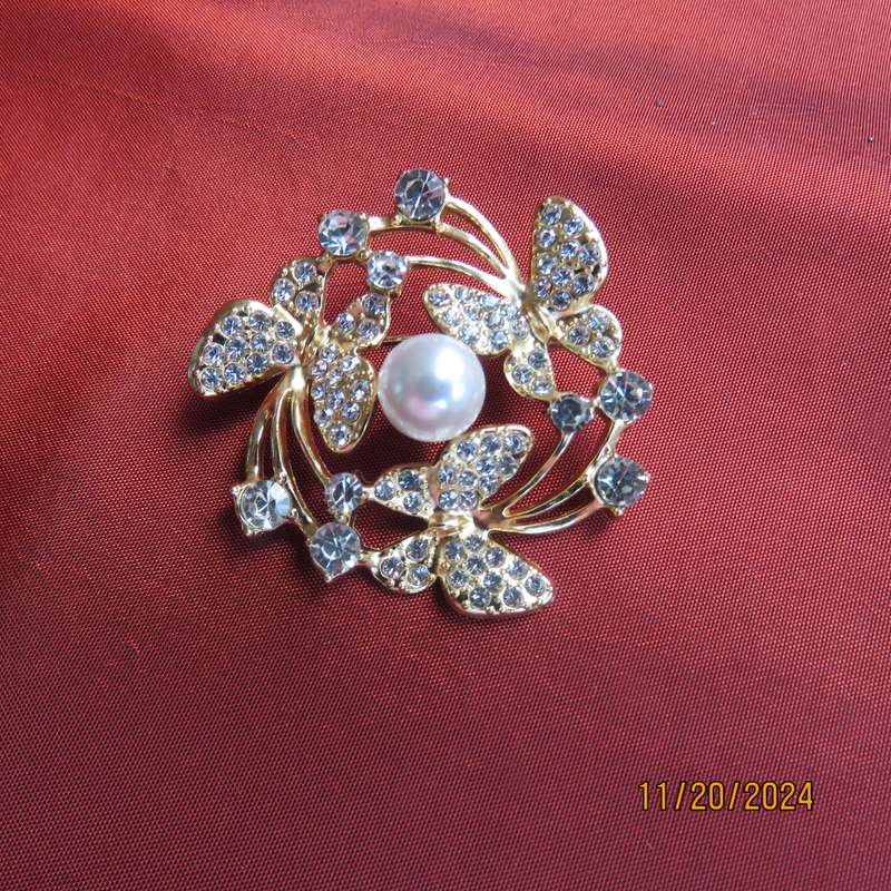 Stunning butterfly brooch 4cm diam. in gold with lots of simulated diamonds. New item.
