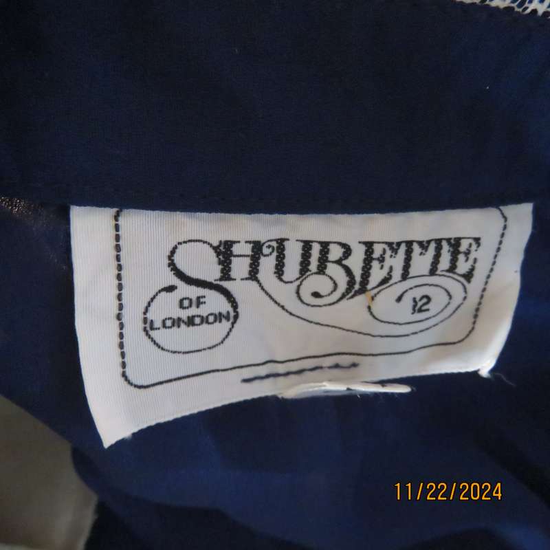 Amazing navy SHUBETTE of LONDON vintage long sleeves sheer polyester dress. Size 36.Lined.Cream lace