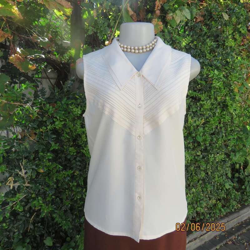 FEMININE sleeveless rich cream blouse from Tokyo in size 34. Dainty double collar.