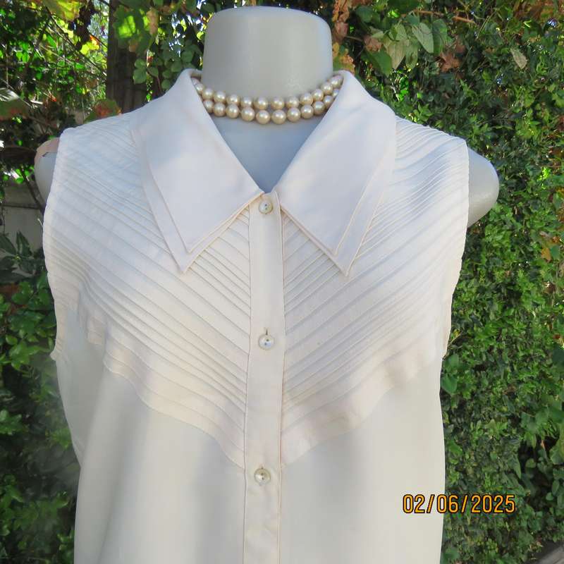 FEMININE sleeveless rich cream blouse from Tokyo in size 34. Dainty double collar.
