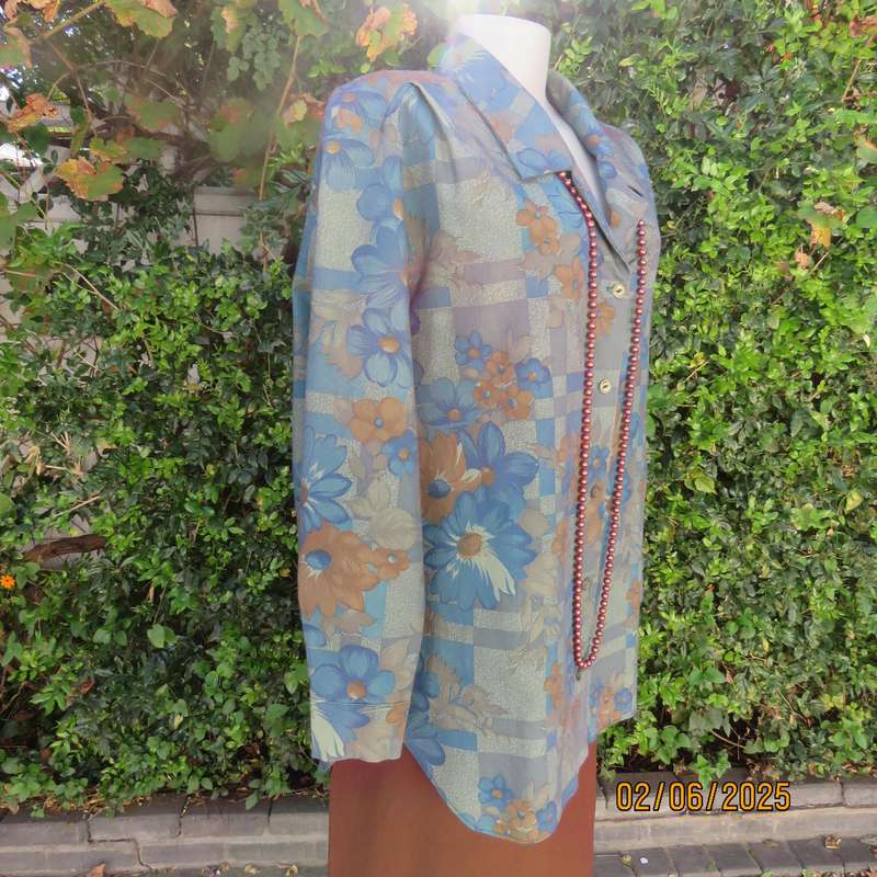 Owner made long sleeve polycotton top in blues-brown patterns. Size 42-44. Open collar