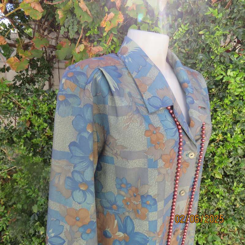 Owner made long sleeve polycotton top in blues-brown patterns. Size 42-44. Open collar