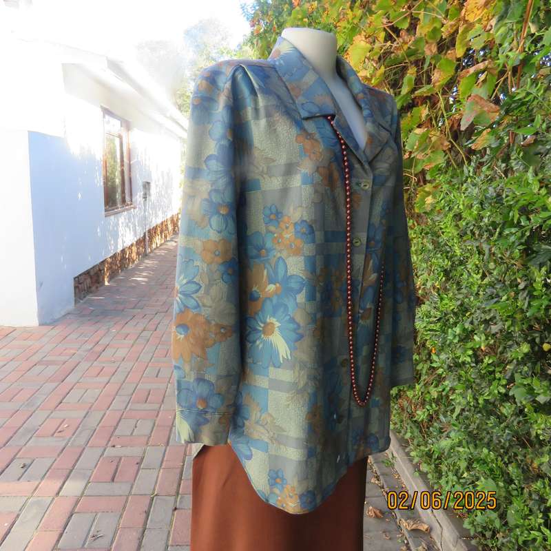 Owner made long sleeve polycotton top in blues-brown patterns. Size 42-44. Open collar