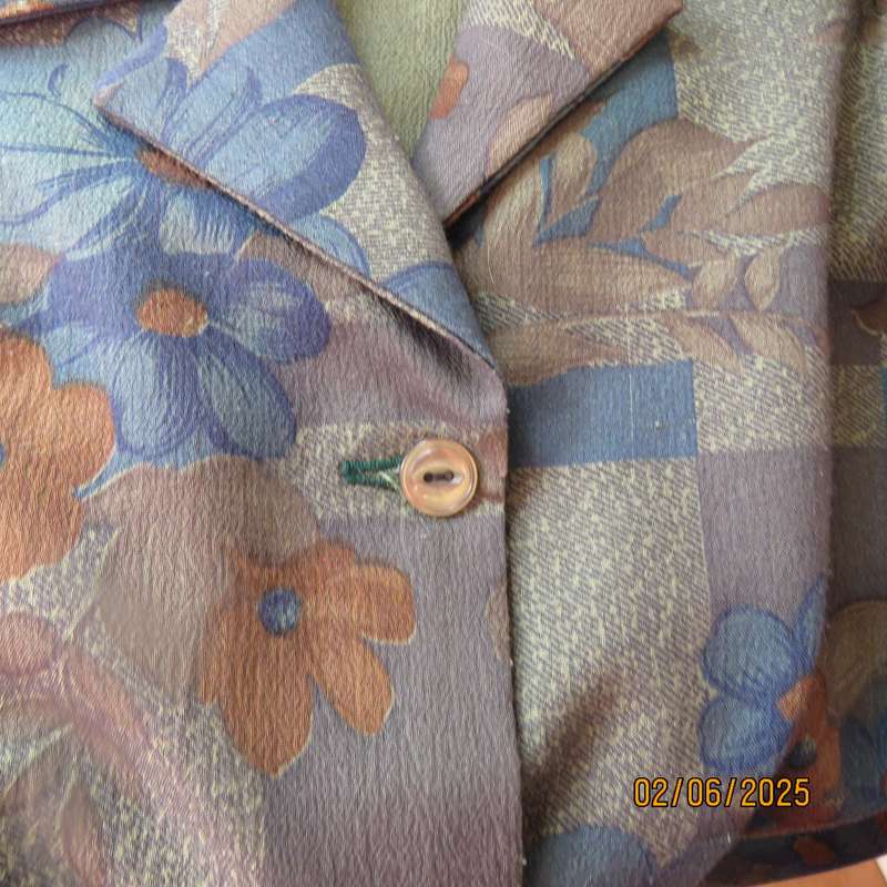 Owner made long sleeve polycotton top in blues-brown patterns. Size 42-44. Open collar