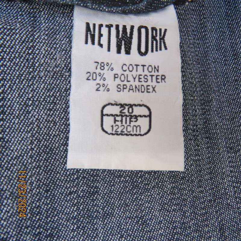 As new dark blue denim jean uniquely paneled kick-out skirt size 44. Bandless. Polycotton stretch.
