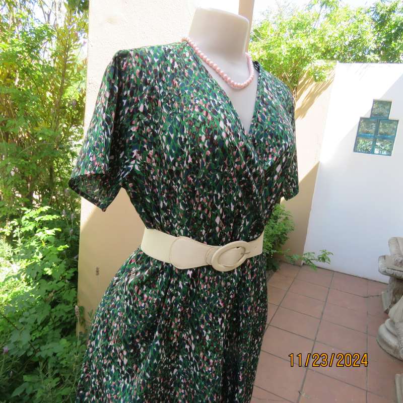 Maxi boutique made colourful dress with cross over bustline and elasticated waist. Size 40. As new