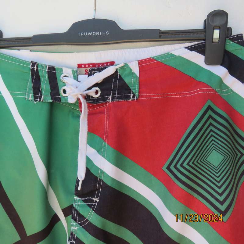 SOFICH Non Stop men's boardshorts in red-green-black and white graphic print. Size 34.As new.