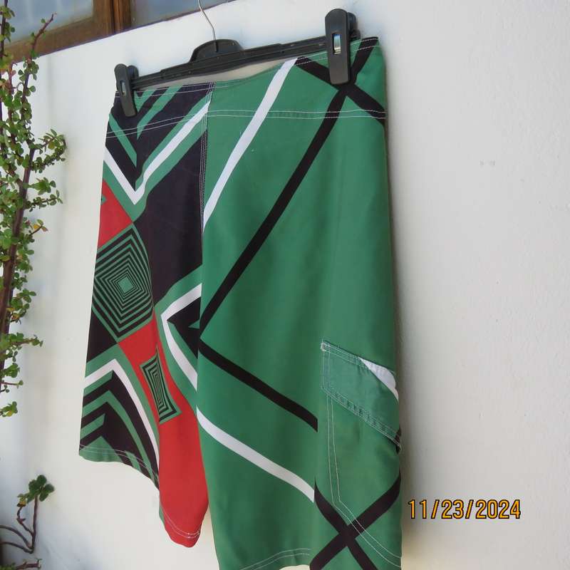 SOFICH Non Stop men's boardshorts in red-green-black and white graphic print. Size 34.As new.