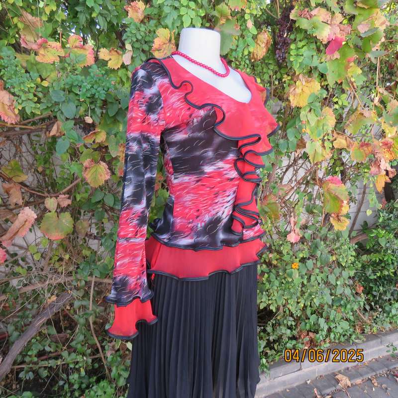 Glamour long sleeve top in red-black-grey sheer polyester. Frilled long sleeves. Size 32