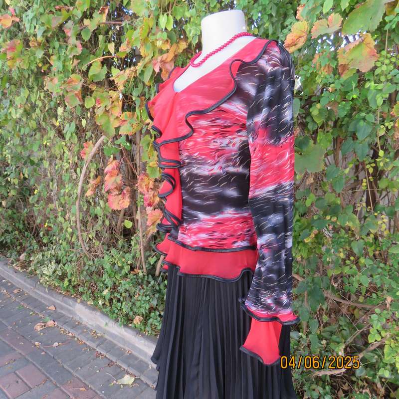 Glamour long sleeve top in red-black-grey sheer polyester. Frilled long sleeves. Size 32