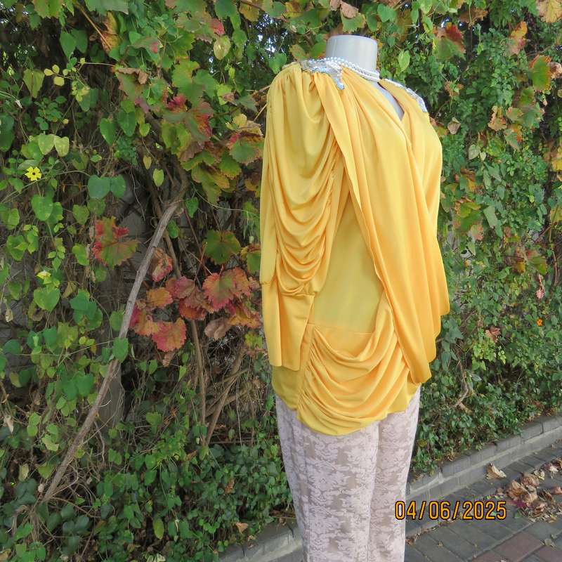Buttercup yellow unique size 40 stretch polyester top. Crossover overlays. Shoulder decoration.