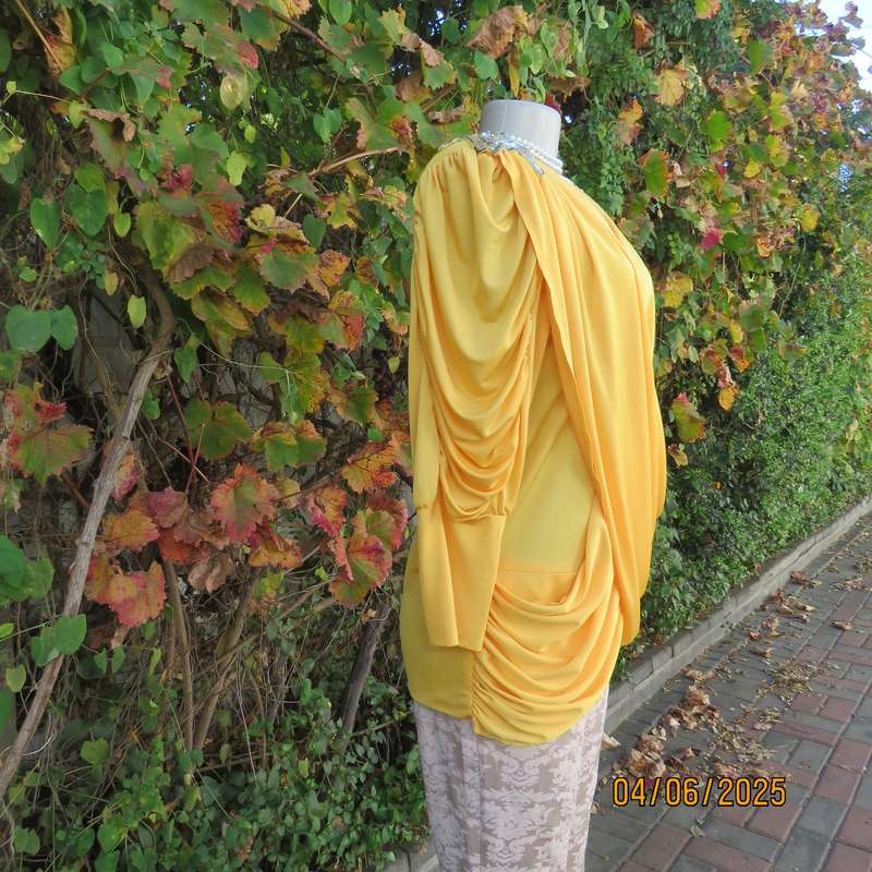 Buttercup yellow unique size 40 stretch polyester top. Crossover overlays. Shoulder decoration.