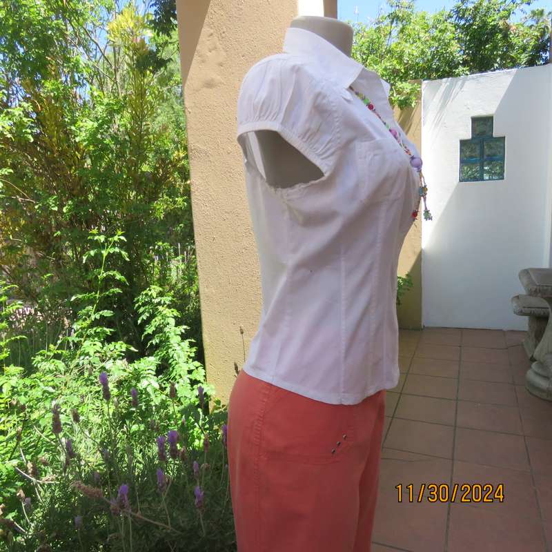 Pretty white capped sleeve button down tailored top. Cute pockets. Shirt collar. Size 38. As new