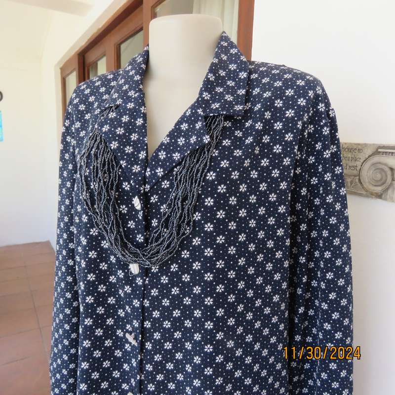 Classic navy long sleeve button down top with tiny white flowers.Size 42. Button down.As new