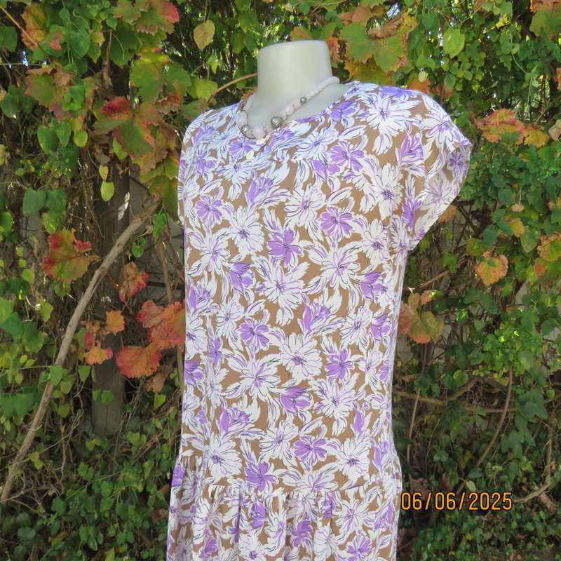Vintage drop waist stretch polyester dress in tan with white-lilac flowers. Size 38