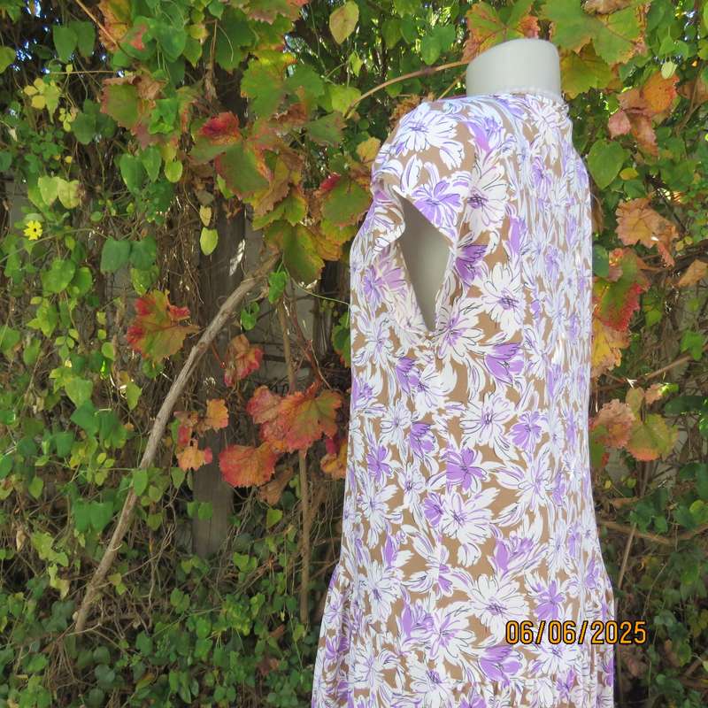 Vintage drop waist stretch polyester dress in tan with white-lilac flowers. Size 38