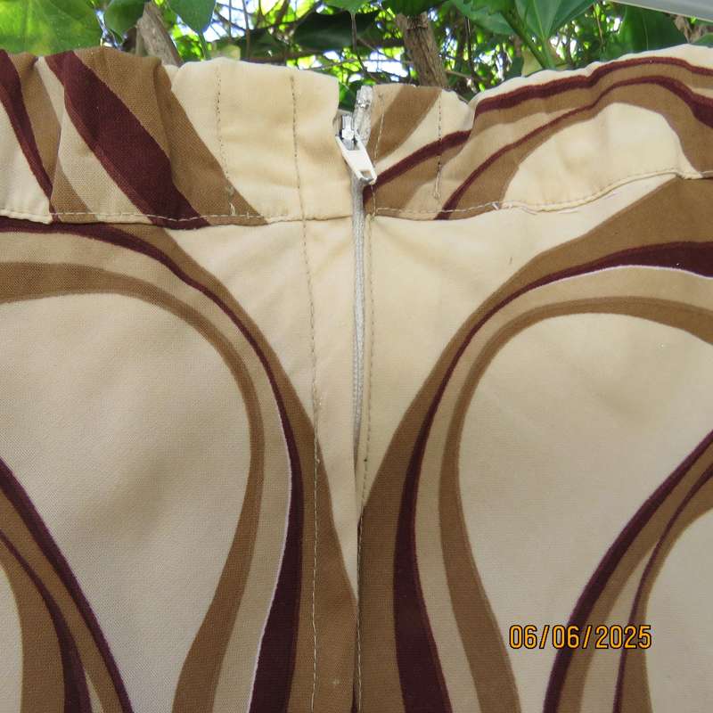 Graphic printed rich cream fully lined polyester A-Line skirt. Brown-tan print. Size 50