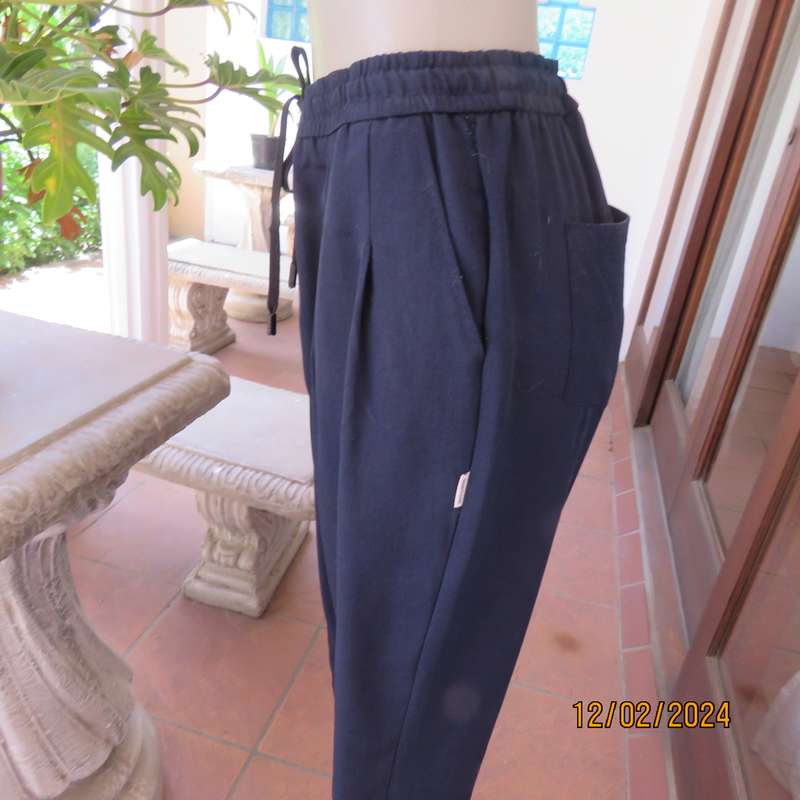 Comfy wide cut navy polyester pants size 38. Front pleats.Elasticated waist -leg hems. Drawstring.