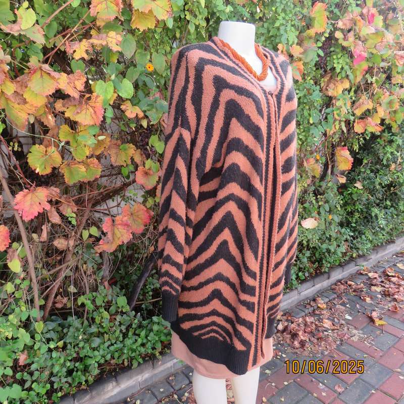 Warm extra long black-tan zig-zag style patterned acrylic knit jacket. Size 40.