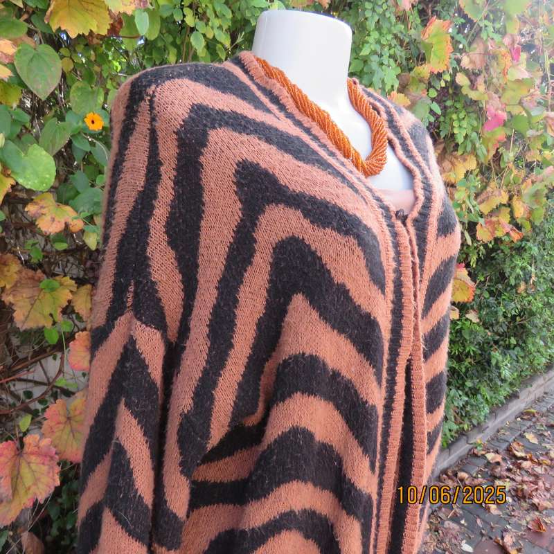 Warm extra long black-tan zig-zag style patterned acrylic knit jacket. Size 40.