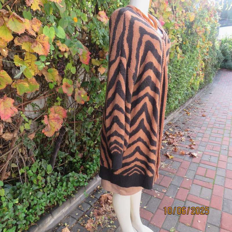 Warm extra long black-tan zig-zag style patterned acrylic knit jacket. Size 40.