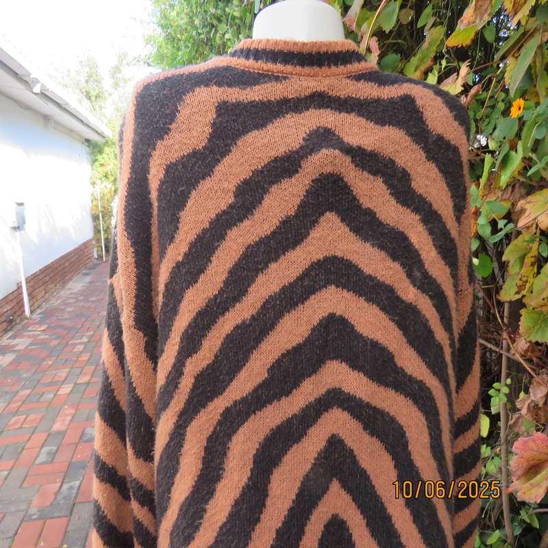 Warm extra long black-tan zig-zag style patterned acrylic knit jacket. Size 40.