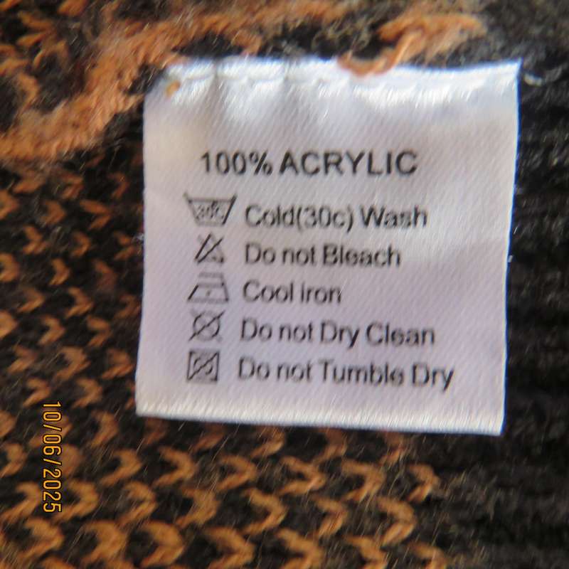Warm extra long black-tan zig-zag style patterned acrylic knit jacket. Size 40.