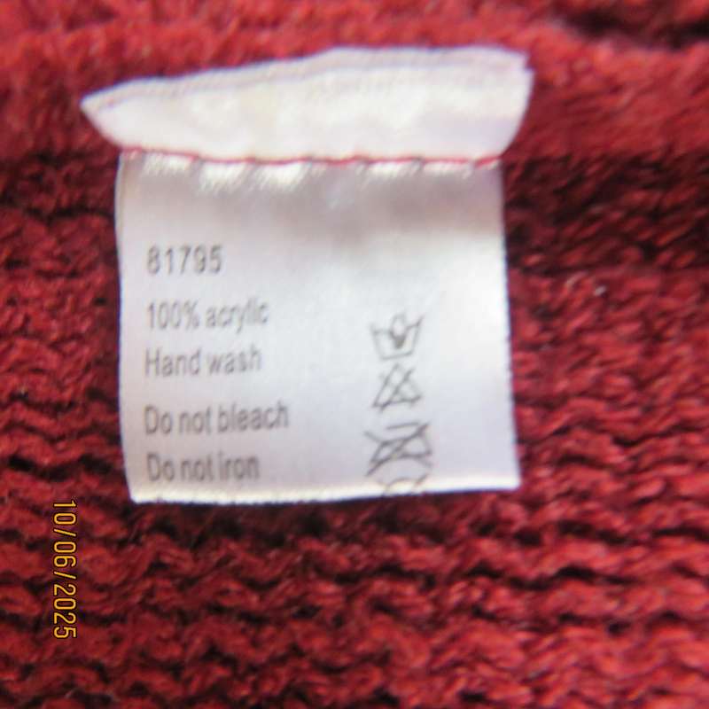 Maroon acrylic knit poncho partly fringed to fit size 32 to 36.