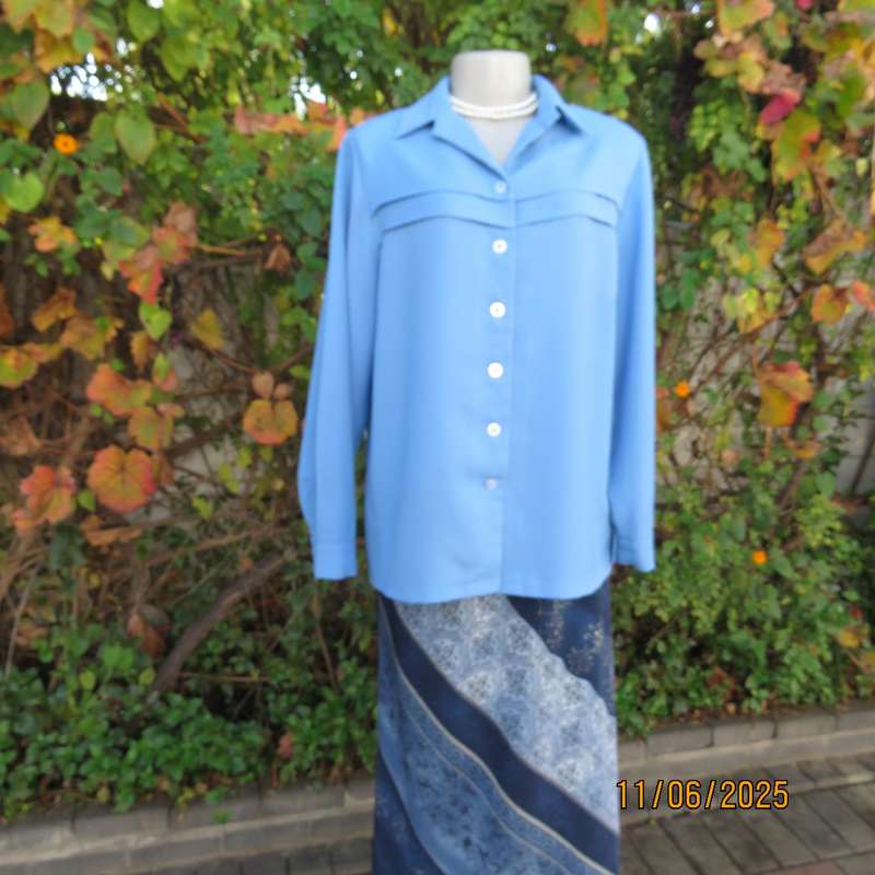 Skyblue boutique made long sleeve button down top. Tucked seams. Size 40