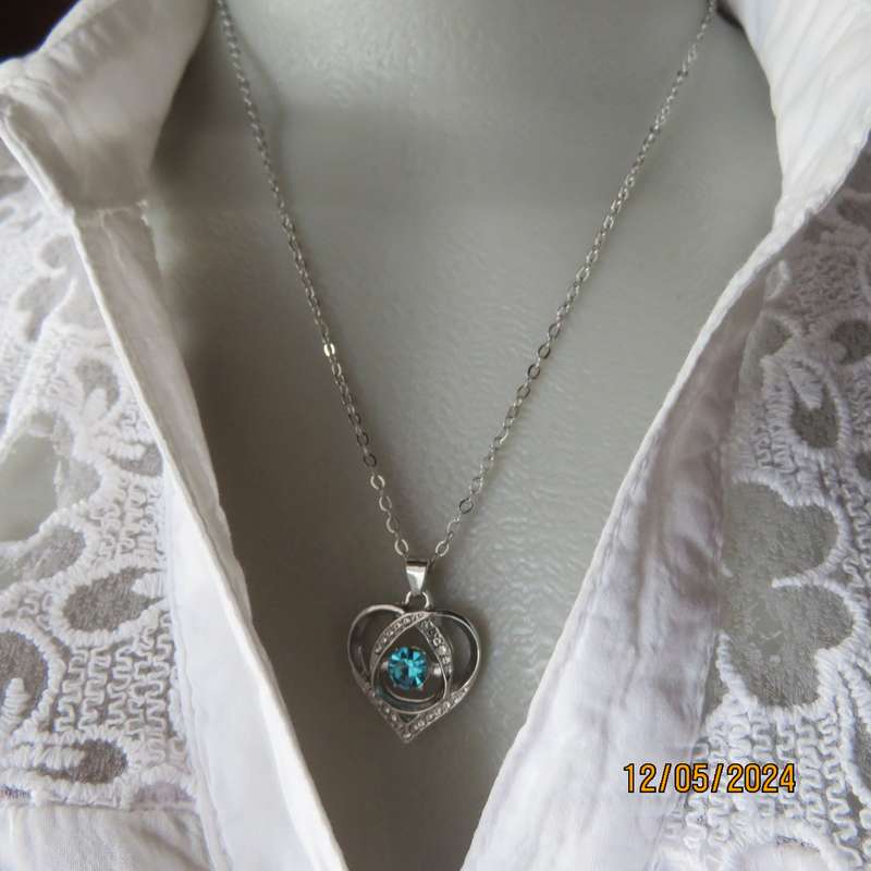 Dainty heart pendant with blue stone and faux diamonds. Silver chain. New item.