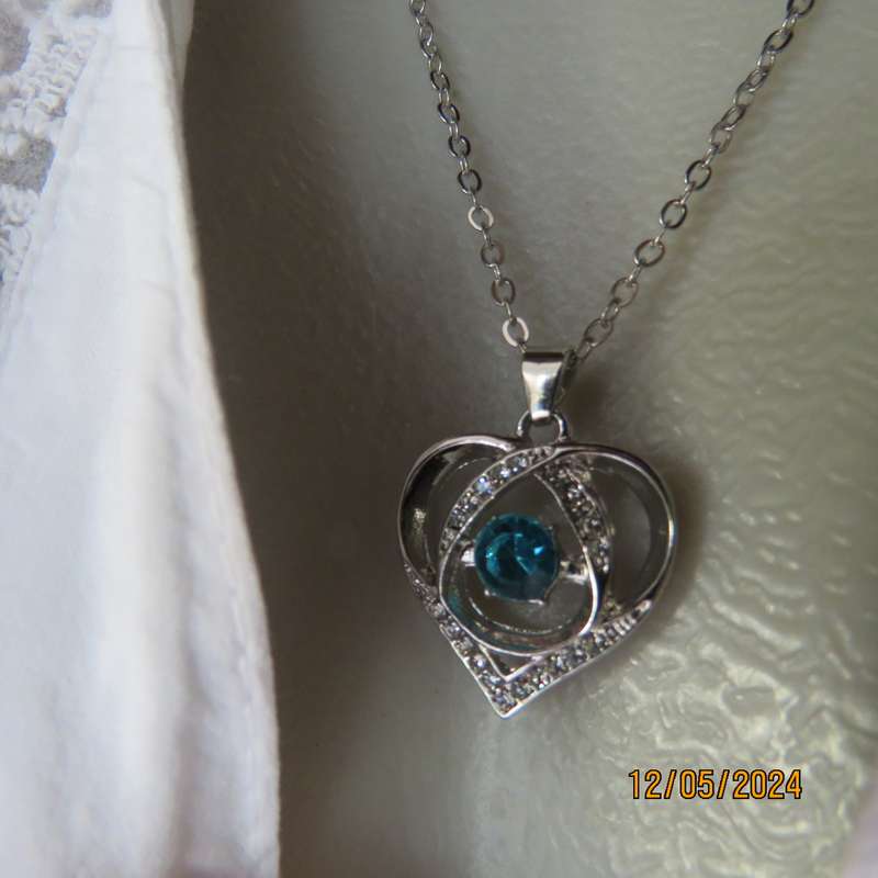 Dainty heart pendant with blue stone and faux diamonds. Silver chain. New item.