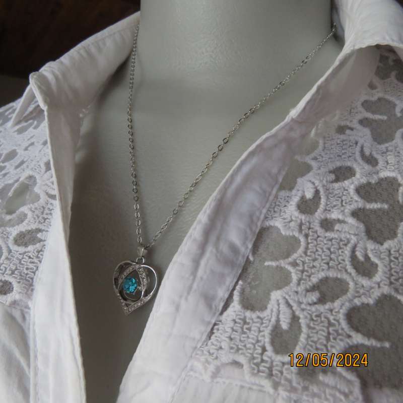 Dainty heart pendant with blue stone and faux diamonds. Silver chain. New item.