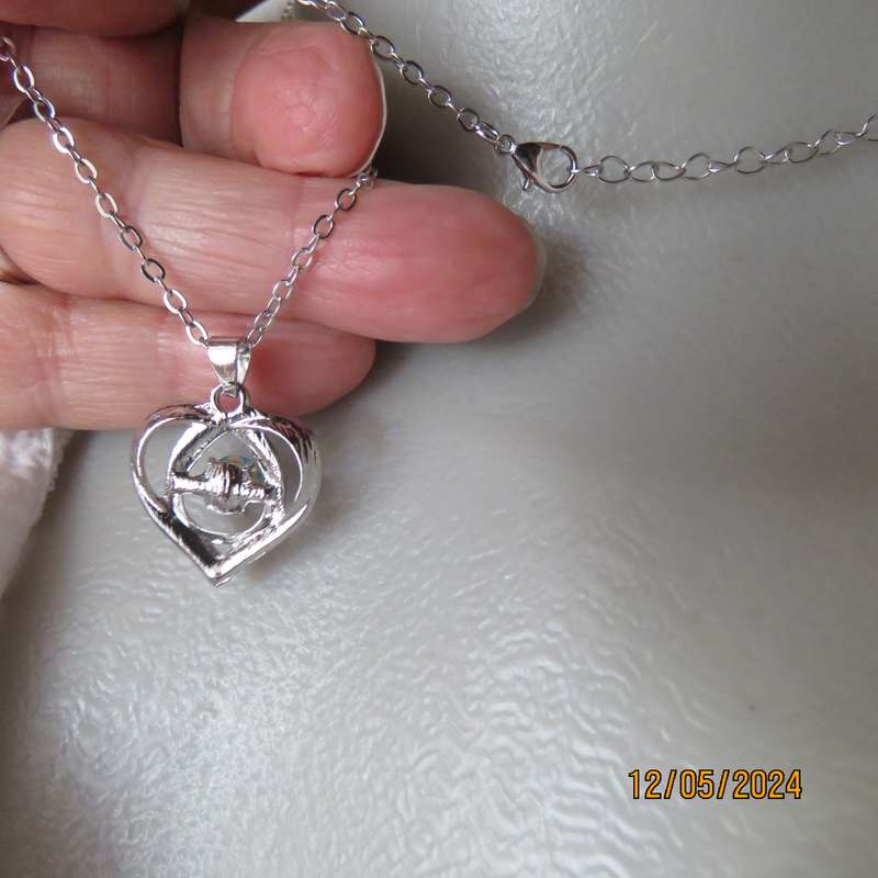 Dainty heart pendant with blue stone and faux diamonds. Silver chain. New item.