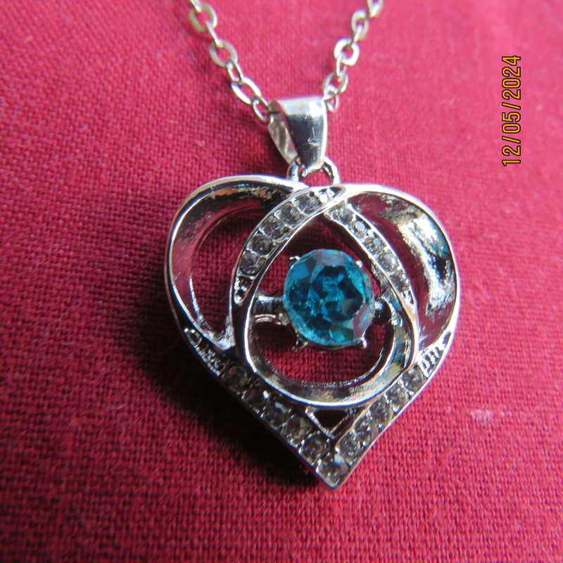 Dainty heart pendant with blue stone and faux diamonds. Silver chain. New item.