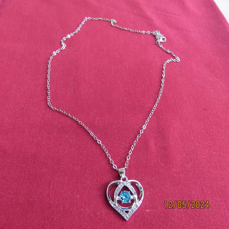 Dainty heart pendant with blue stone and faux diamonds. Silver chain. New item.