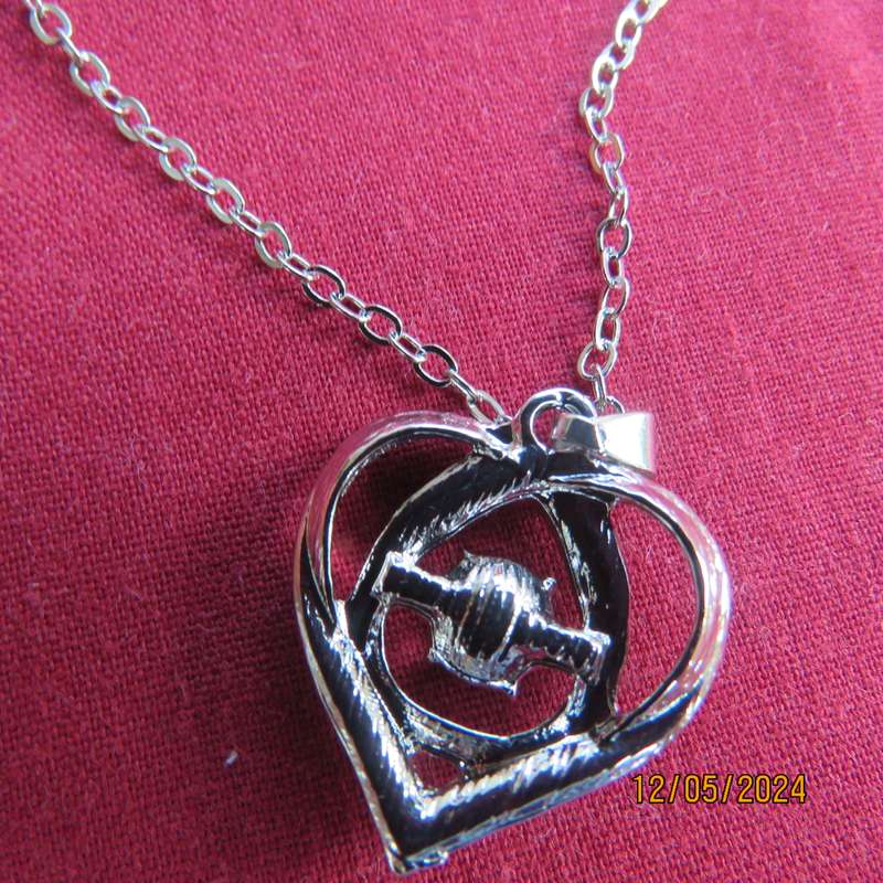 Dainty heart pendant with blue stone and faux diamonds. Silver chain. New item.