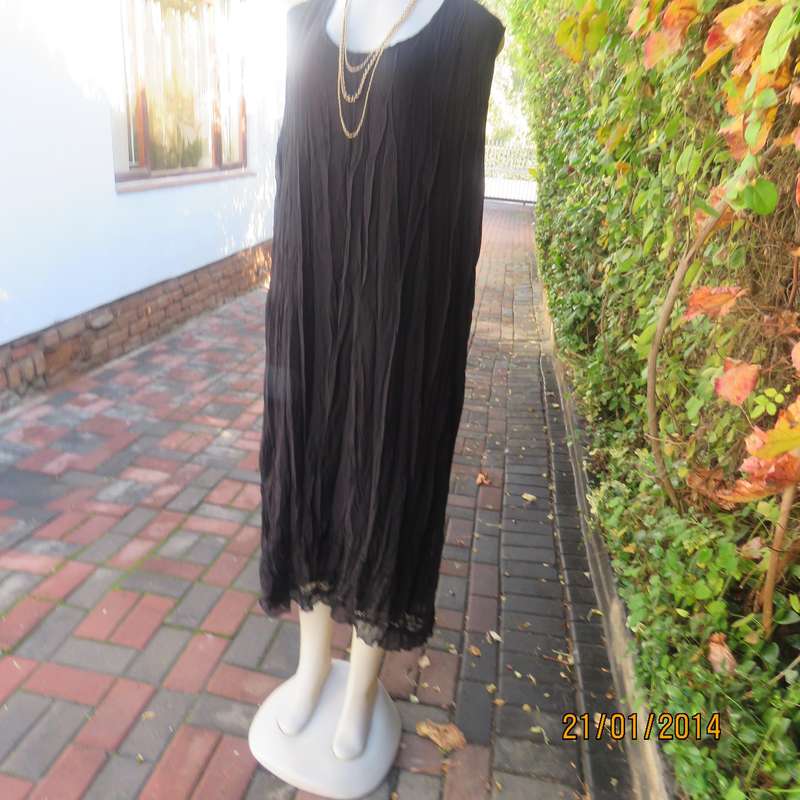 Black slip over vertically creased 2 layer sheer polycotton dress. Size 48